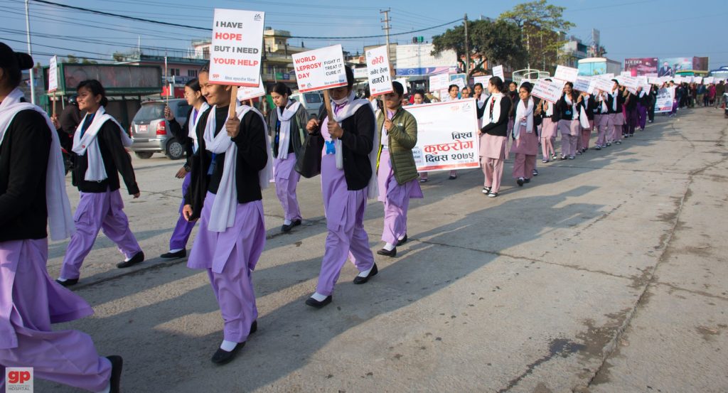 student nurses march on World Leprosy Day